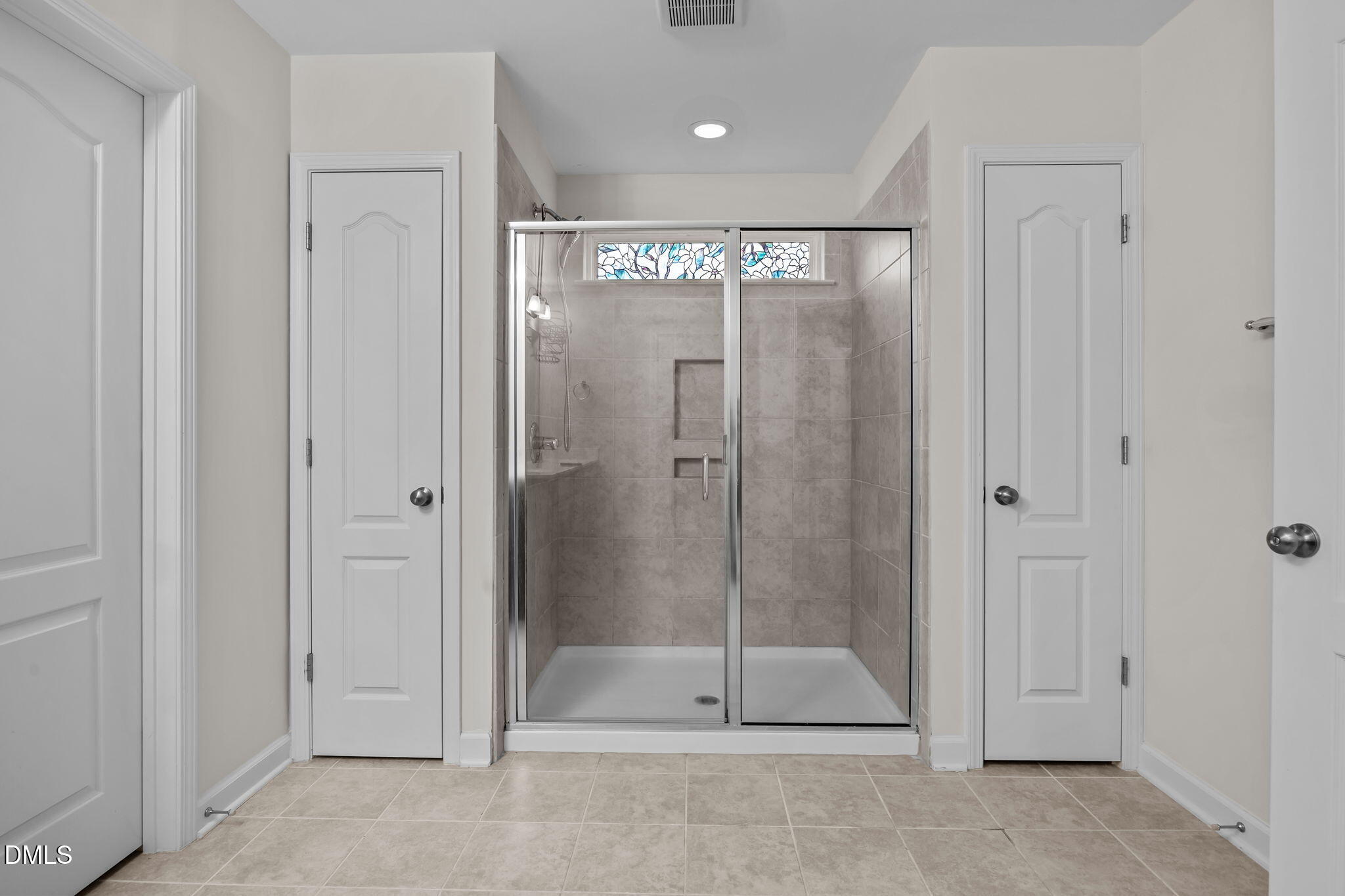 3409 South Beaver Lane Raleigh, NC 27604 - Photo 28 of 31 a bathroom with a shower and a glass door