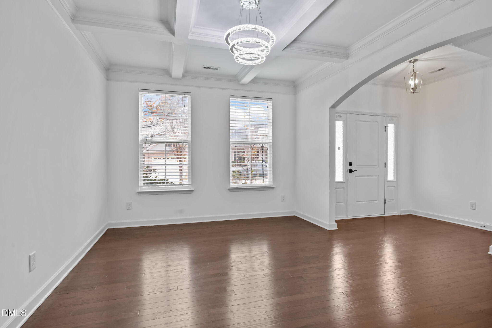 3409 South Beaver Lane Raleigh, NC 27604 - Photo 3 of 31 an empty room with wooden floor and windows