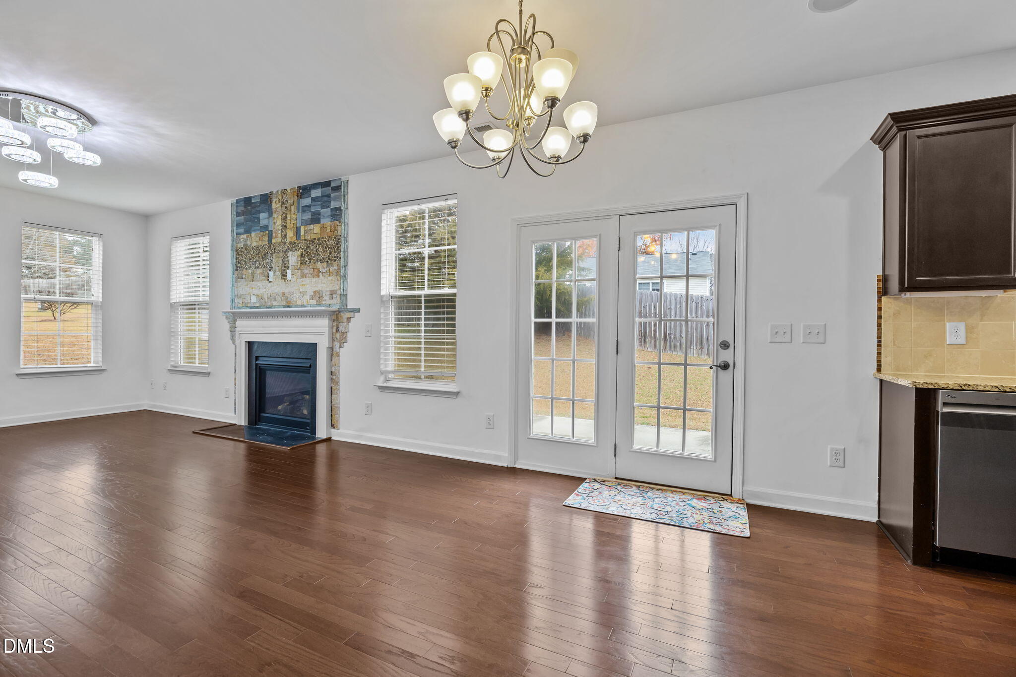 3409 South Beaver Lane Raleigh, NC 27604 - Photo 9 of 31 a view of an empty room with wooden floor and a window