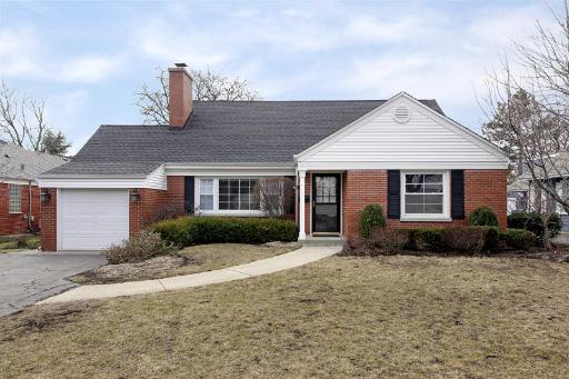 1010 Raleigh Road Glenview, IL 60025 - Photo 1 of 16 a front view of a house with garden