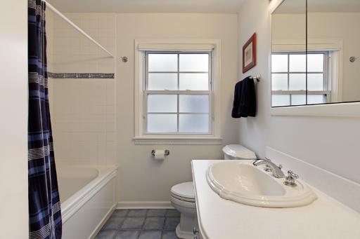 1010 Raleigh Road Glenview, IL 60025 - Photo 14 of 16 a bathroom with a sink a toilet and bathtub