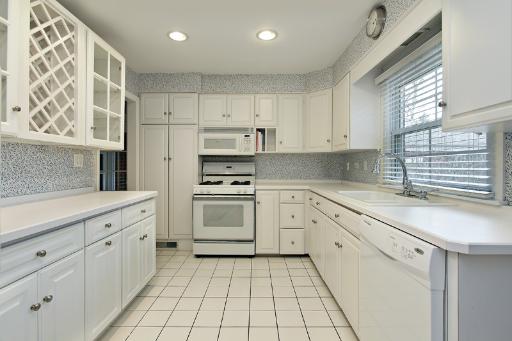 1010 Raleigh Road Glenview, IL 60025 - Photo 5 of 16 a kitchen with cabinets appliances and a window