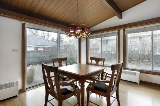 1010 Raleigh Road Glenview, IL 60025 - Photo 6 of 16 a dining room with furniture wooden floor and a chandelier