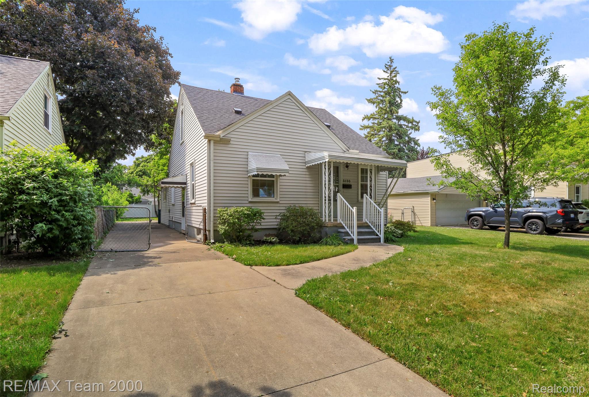 3130 Chestnut Street Dearborn, MI 48124 - Photo 3 of 30 Traditional home exterior featuring horizontal siding and a covered front entry