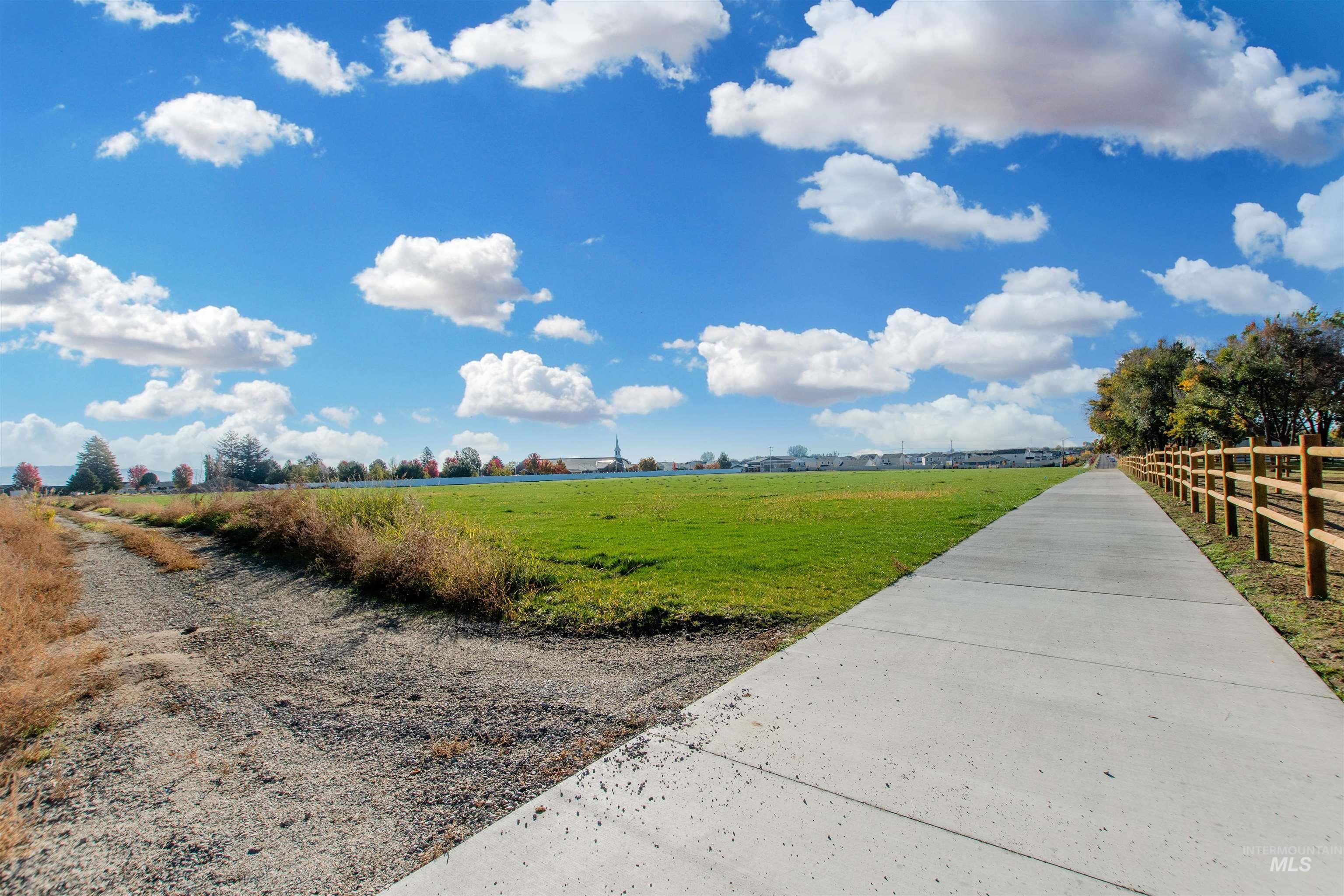 9573 West Stone Oak Lane Star, ID 83669 - Photo 23 of 24 View of home's community featuring a view of countryside and a yard