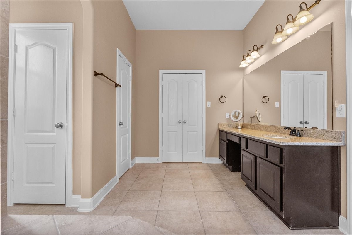 1358 Porta Rosa Lane League City, TX 77573 - Photo 24 of 48 Primary en-suite bath features a walk-in shower, soaking tub, dual vanities and a walk-in closet