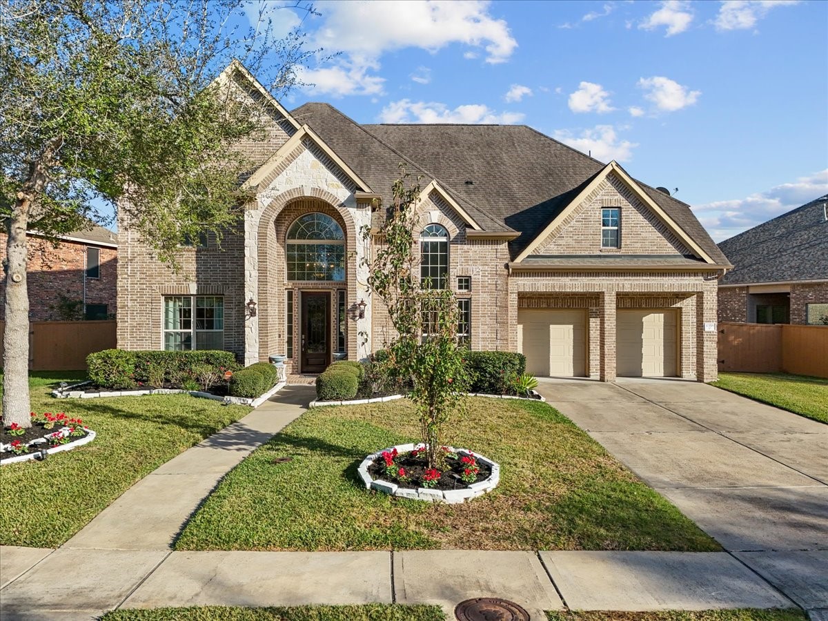 1358 Porta Rosa Lane League City, TX 77573 - Photo 3 of 48 Stunning two-story home situated on a spacious 0.24-acre lot, offering exceptional design and resort-style living. Vacation 365 days a year in the private backyard oasis