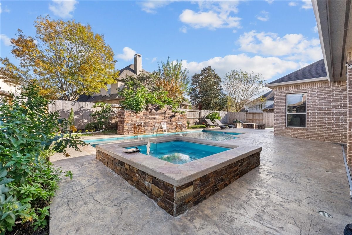 1358 Porta Rosa Lane League City, TX 77573 - Photo 39 of 48 Fire pit, pool, hot tub, covered patio and outdoor kitchen