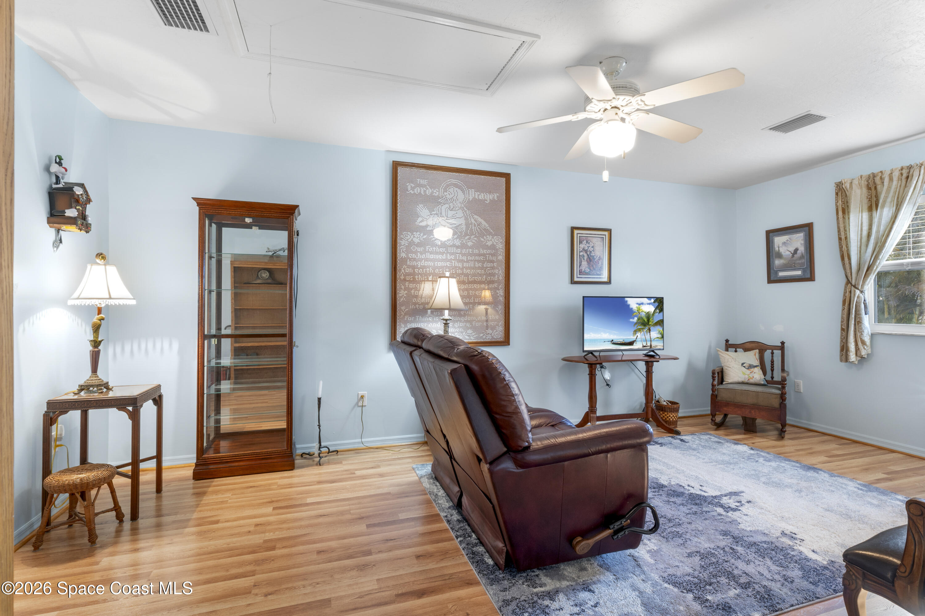 637 Roseland Road Sebastian, FL 32958 - Photo 14 of 36 a living room with furniture and wooden floor