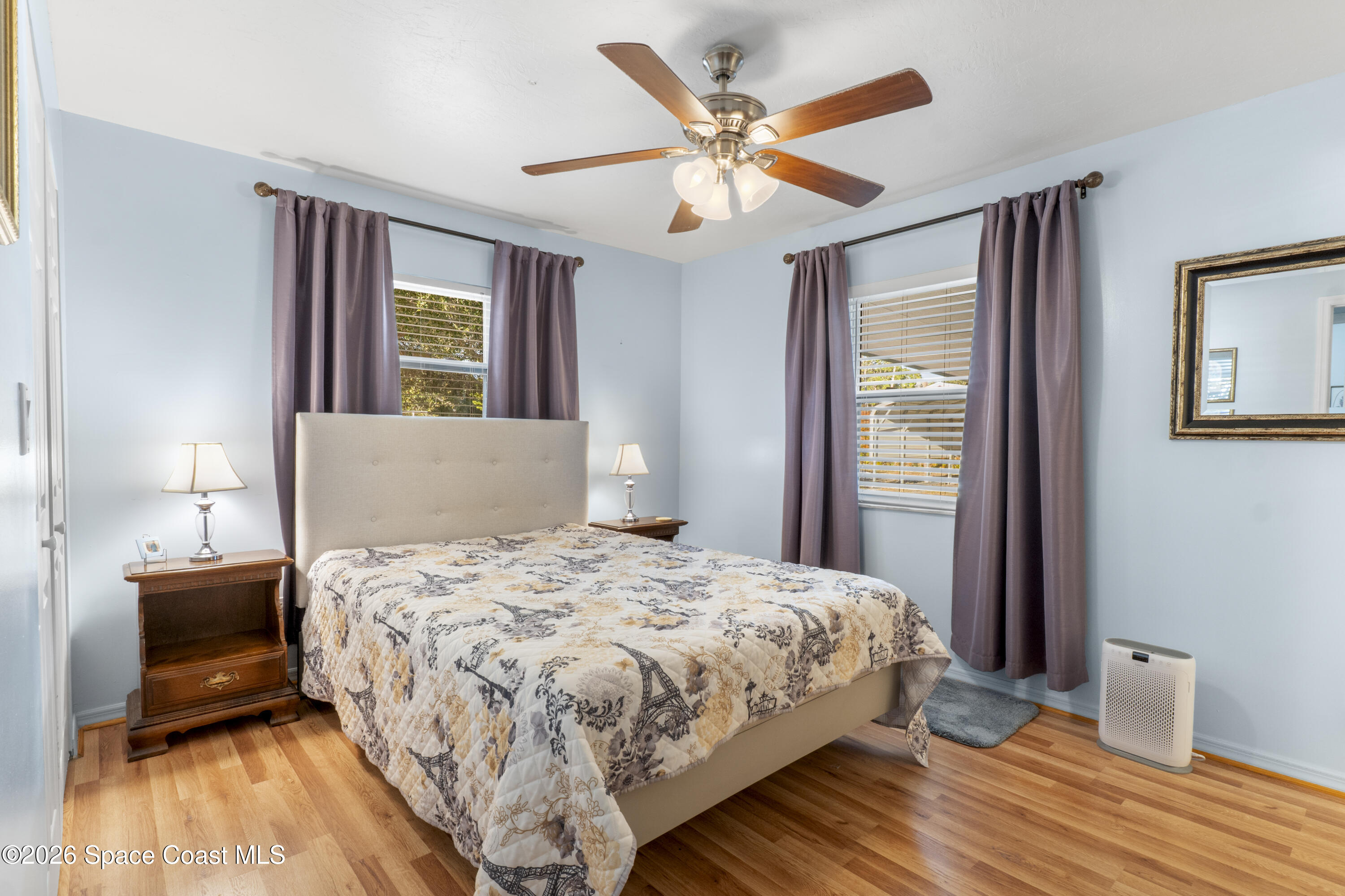 637 Roseland Road Sebastian, FL 32958 - Photo 17 of 36 a bedroom with a bed and a window