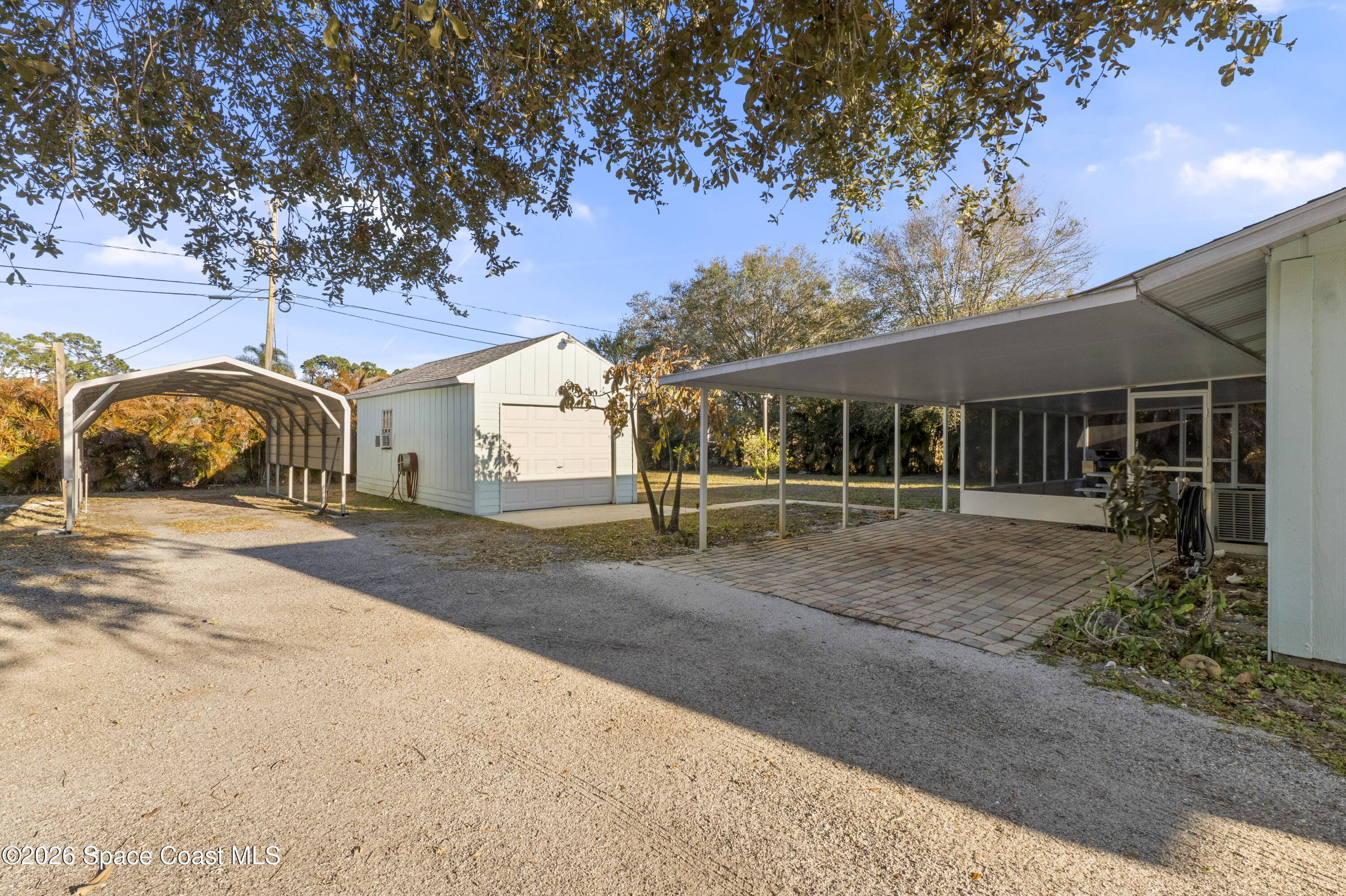 637 Roseland Road Sebastian, FL 32958 - Photo 20 of 36 a front view of a house with a garden