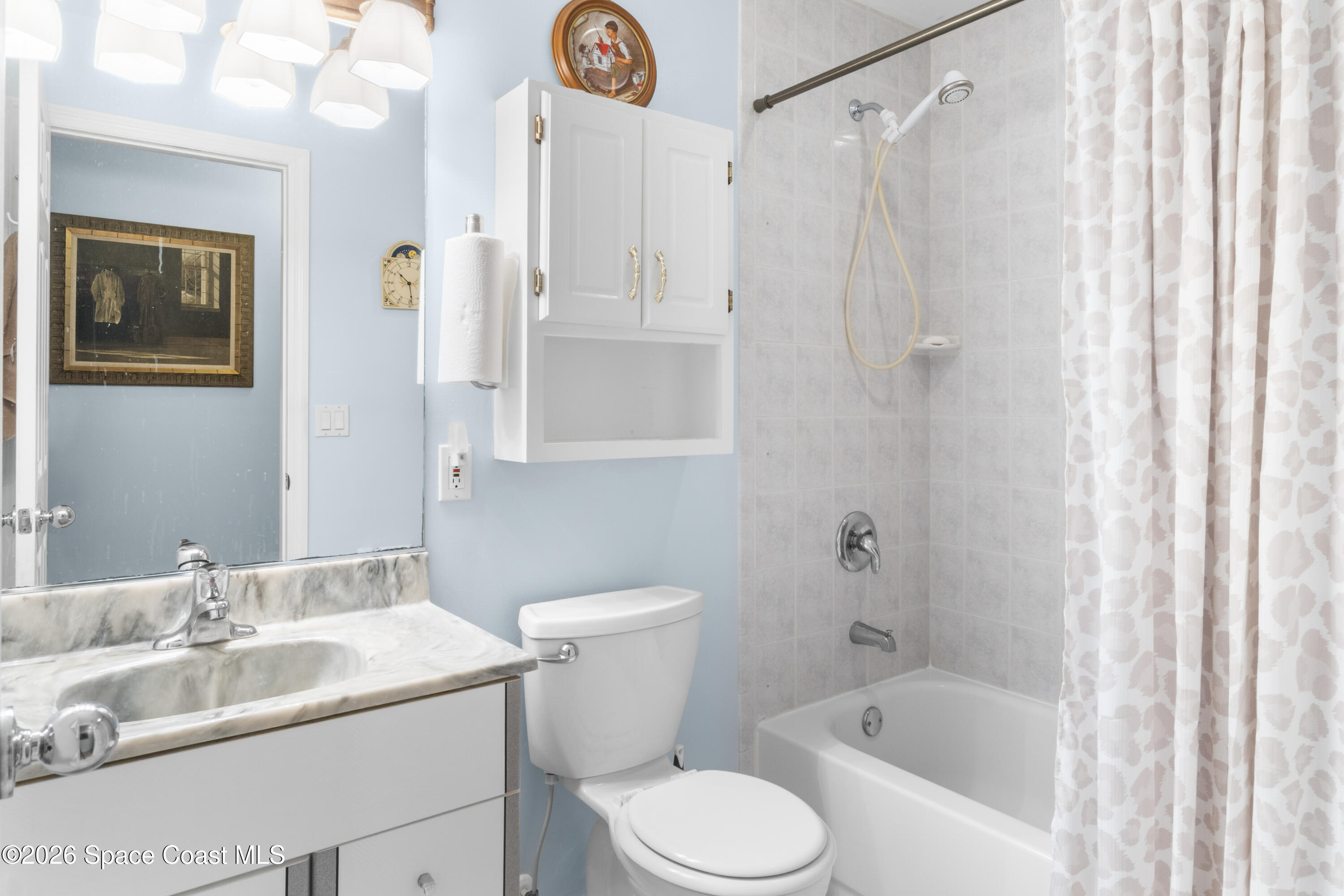 637 Roseland Road Sebastian, FL 32958 - Photo 23 of 36 a bathroom with a sink toilet and shower