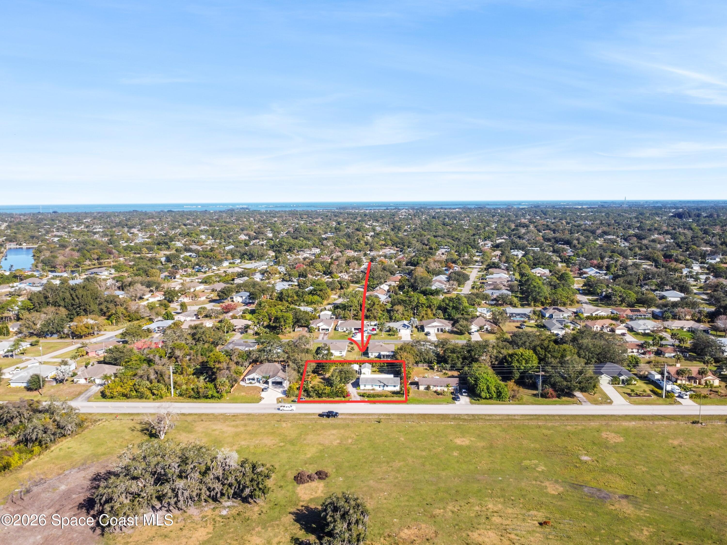637 Roseland Road Sebastian, FL 32958 - Photo 34 of 36 an aerial view of residential building and ocean