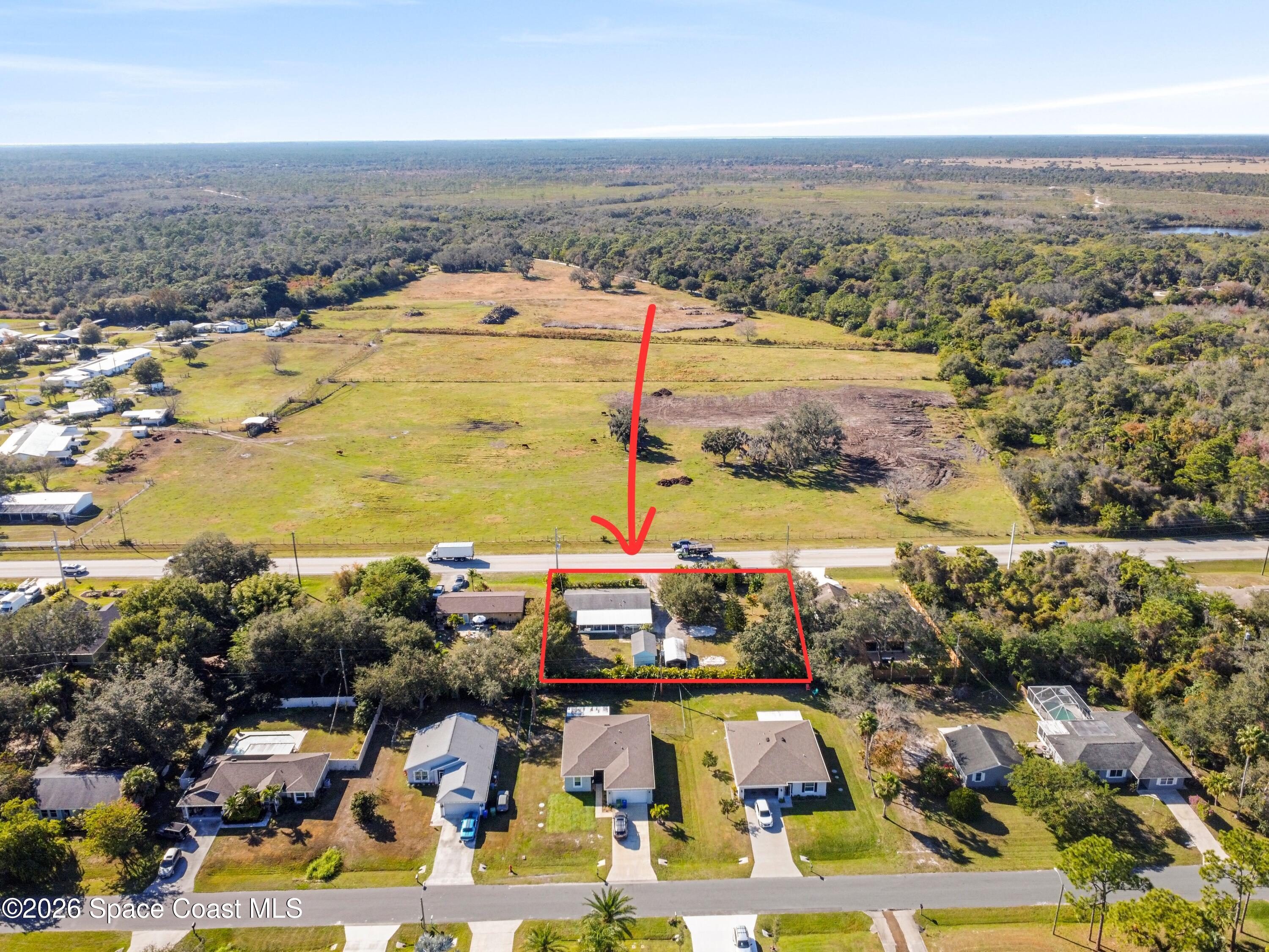 637 Roseland Road Sebastian, FL 32958 - Photo 35 of 36 an aerial view of ocean and residential houses with outdoor space