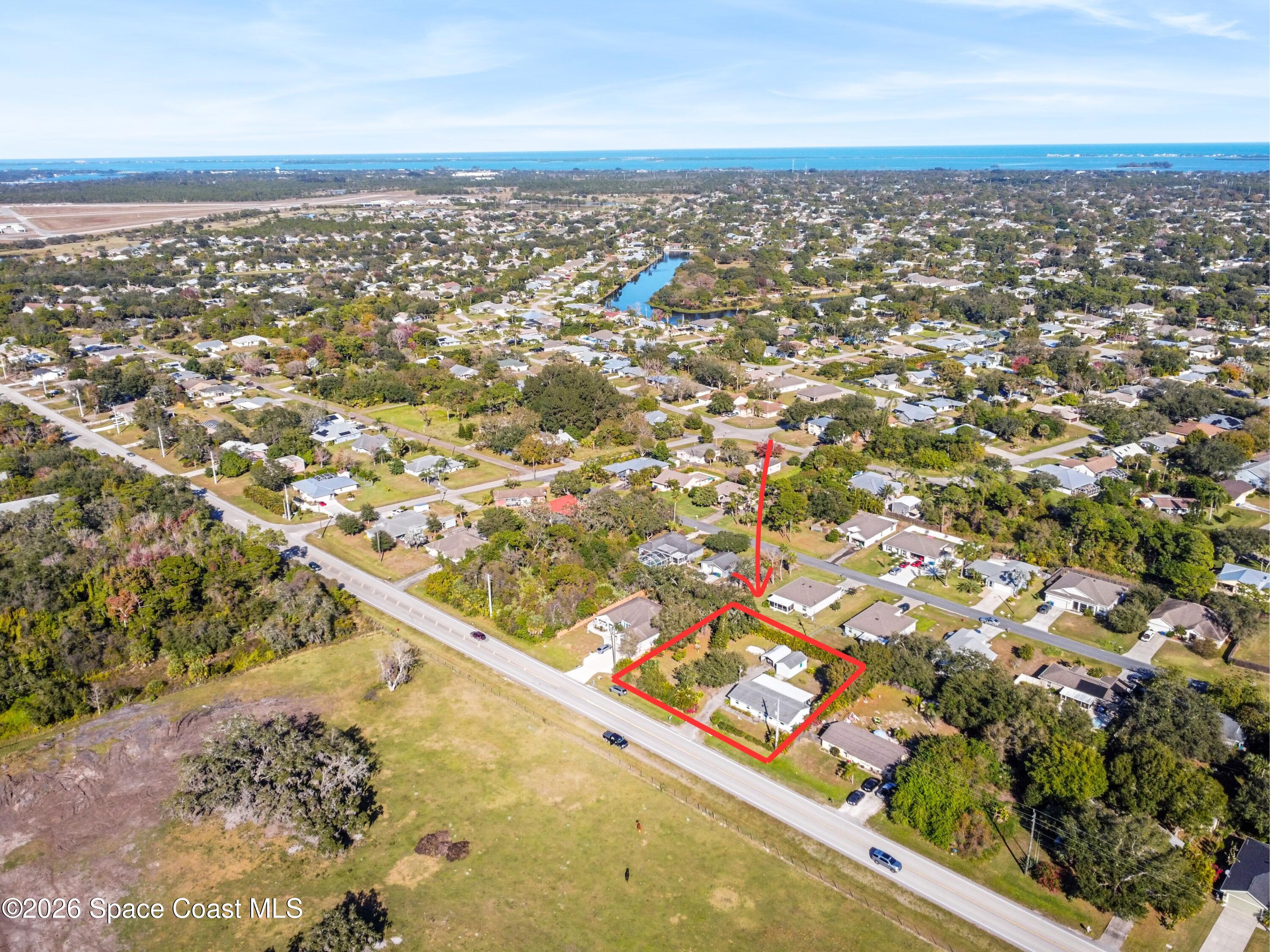 637 Roseland Road Sebastian, FL 32958 - Photo 4 of 36 an aerial view of residential houses with outdoor space