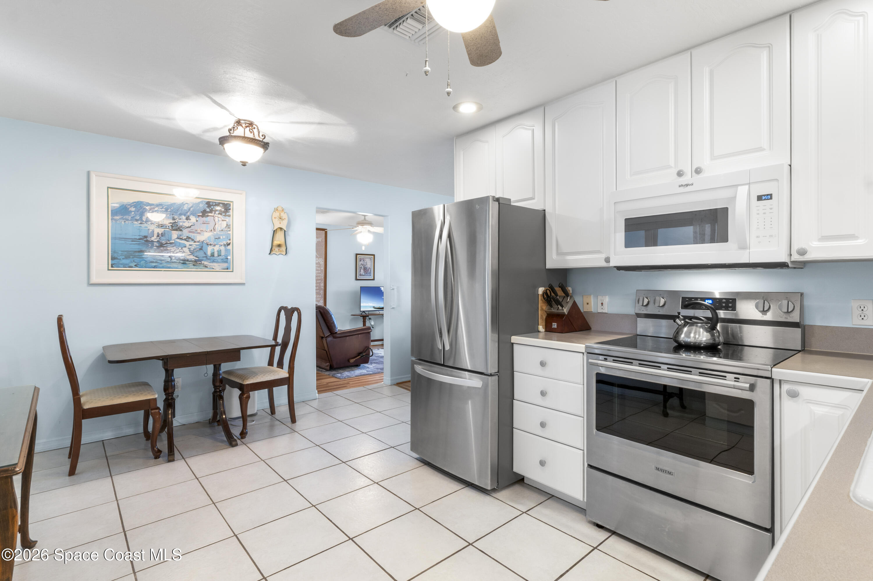 637 Roseland Road Sebastian, FL 32958 - Photo 10 of 36 a kitchen with stainless steel appliances granite countertop a stove a sink dishwasher and a refrigerator