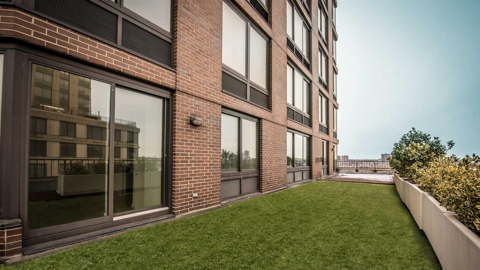 180 Riverside Boulevard, Unit 16K Manhattan, NY 10069 - Photo 2 of 10 a view of a back yard