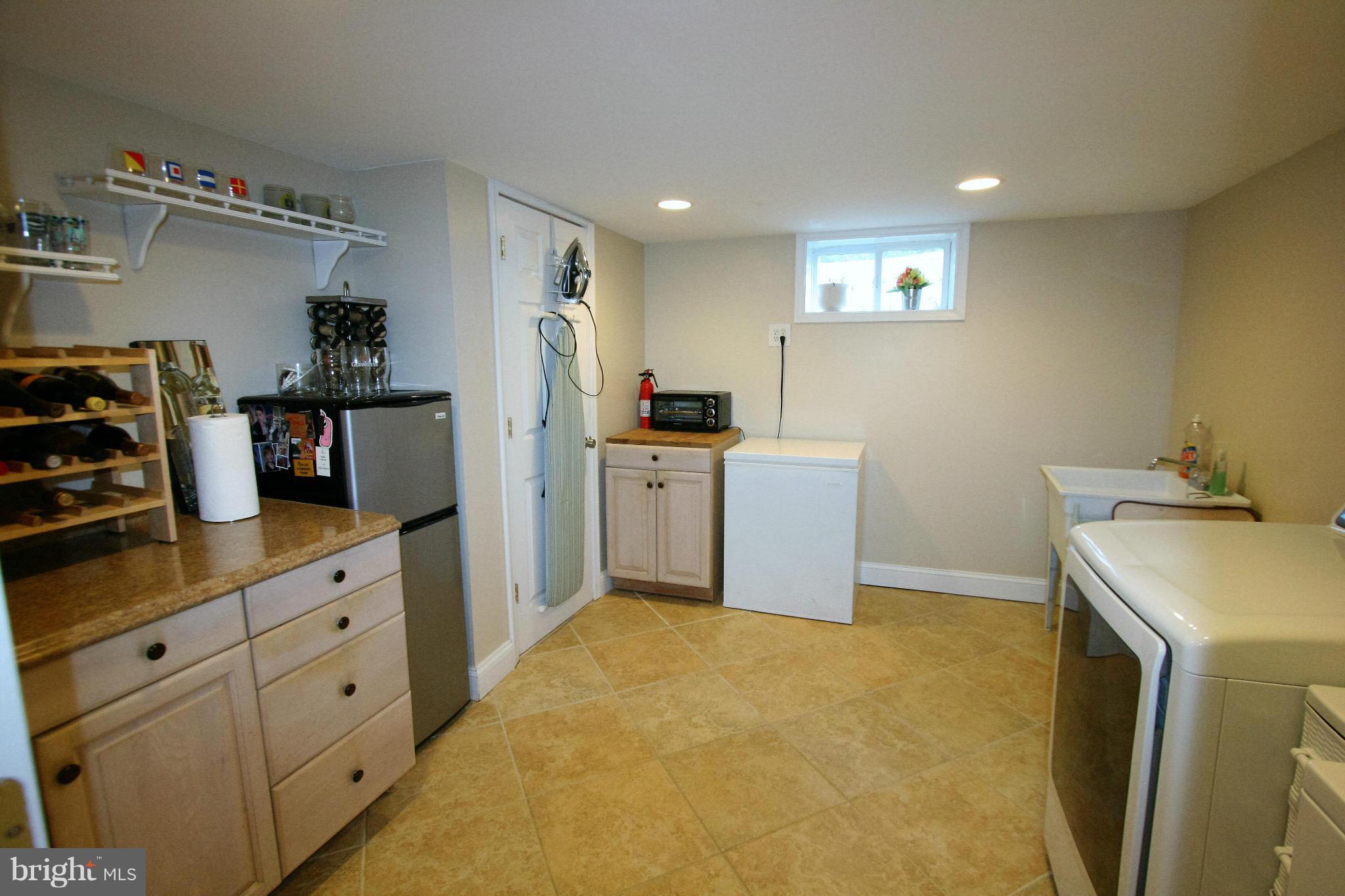 5904 Frederick Street Springfield, VA 22150 - Photo 18 of 23 Separate Laundry room with cabinets!