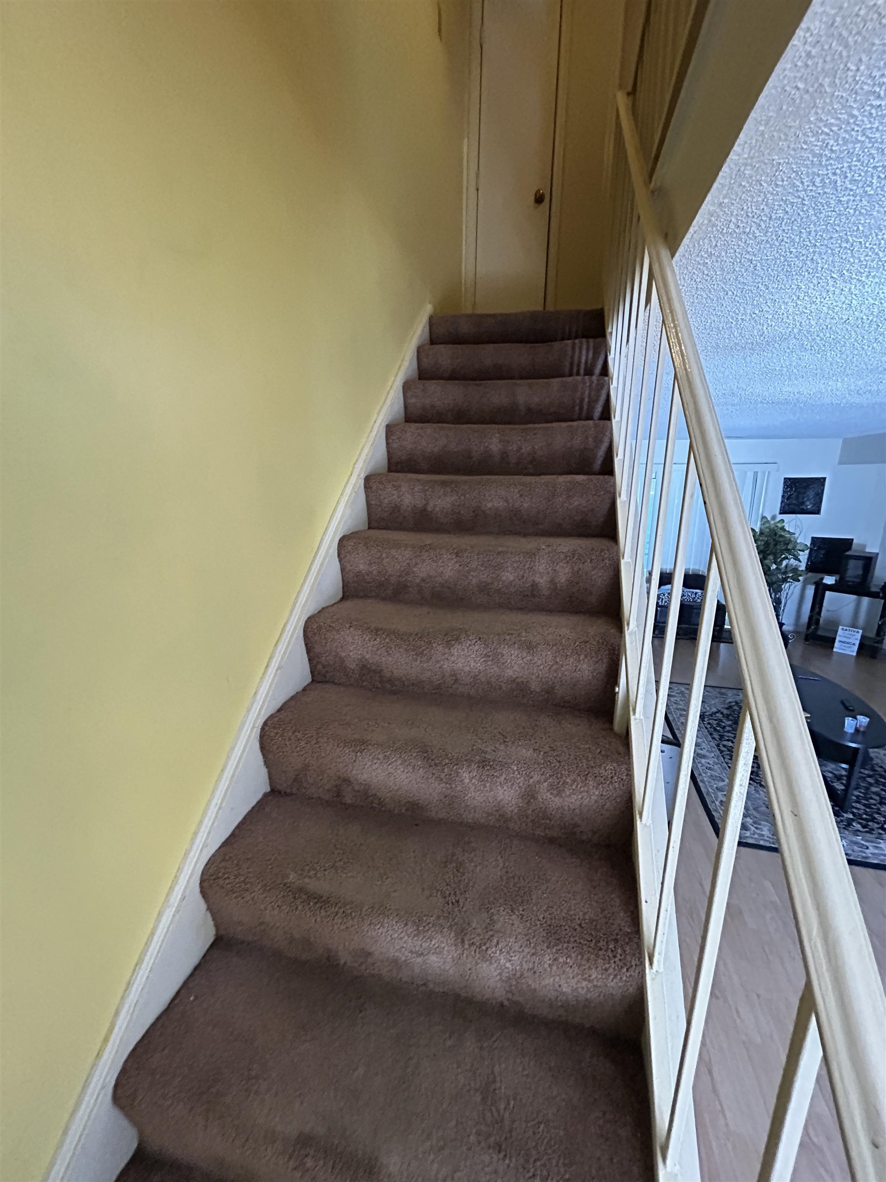 3748 Station Way Memphis, TN 38115 - Photo 5 of 11 Stairway featuring a textured ceiling and baseboards