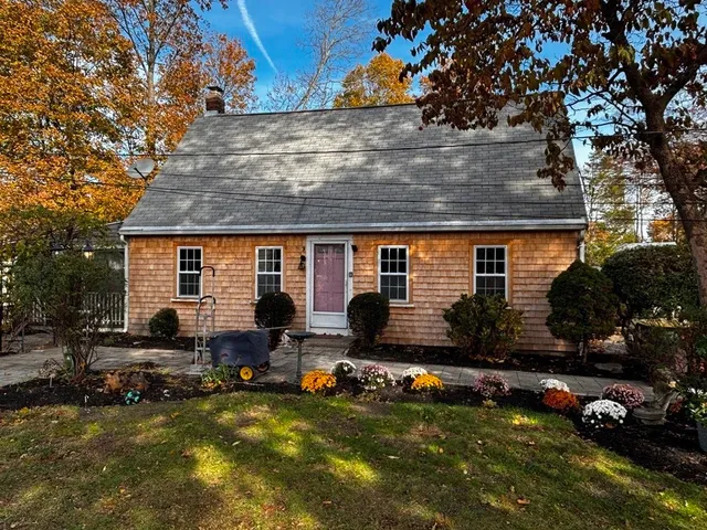 a view of a house with swimming pool and sitting area