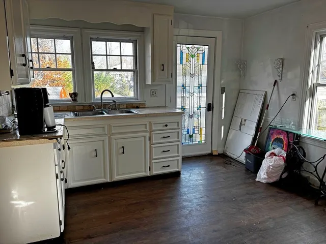 a view of a kitchen with appliances and a window
