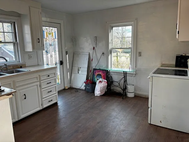 a bedroom with bed and window