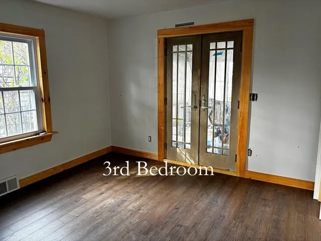 a view of an empty room and window