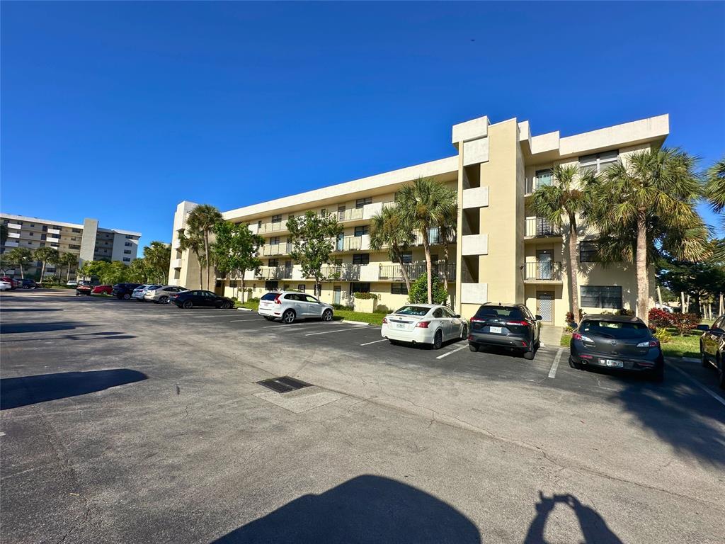 2420 DC Country Club Boulevard, Unit 306 Deerfield Beach, FL 33442 - Photo 2 of 23 a view of a street with cars