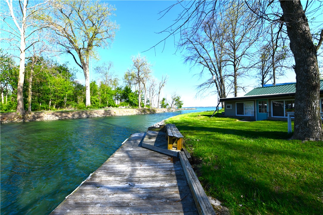 5445 Behm Road, Unit 15 Celina, OH 45822 - Photo 46 of 49 This peaceful waterfront retreat features a private dock and lush green space, perfect for outdoor enjoyment.