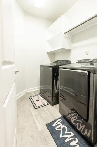 a utility room with washer and dryer
