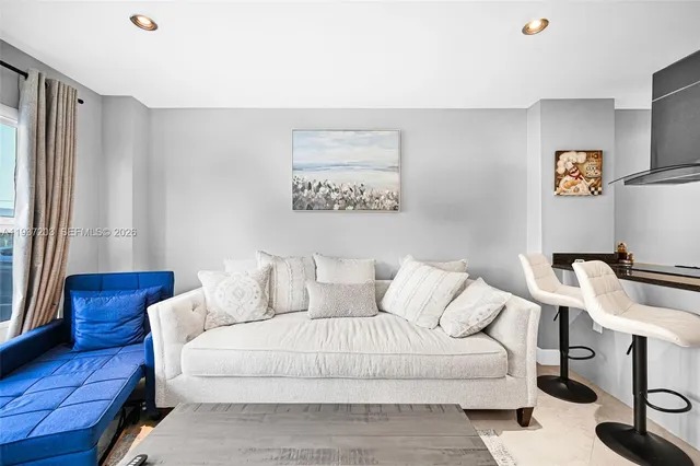 a living room with furniture and a window