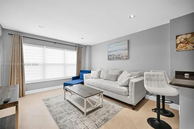 a living room with furniture and a window