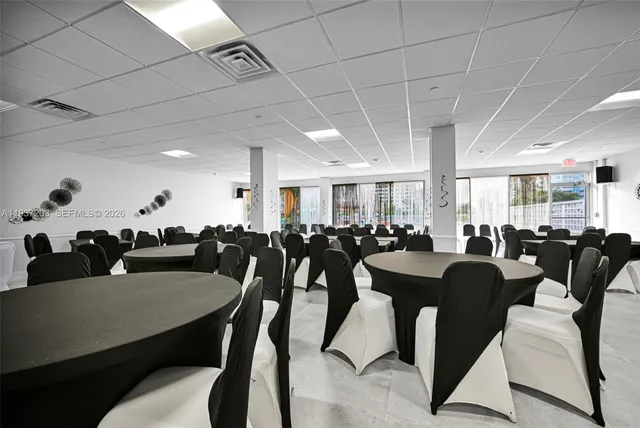 a living room with lots of furniture and a chandelier