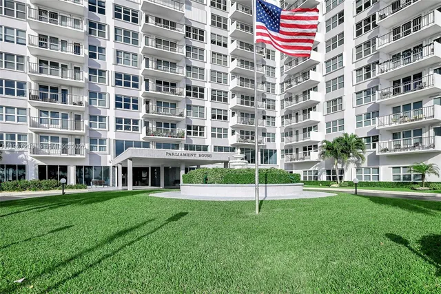 a view of a building with a yard