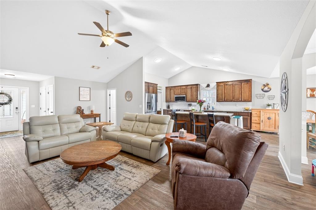 225 Tyler Way Jefferson, GA 30549 - Photo 13 of 43 a living room with furniture ceiling fan and a wooden floor