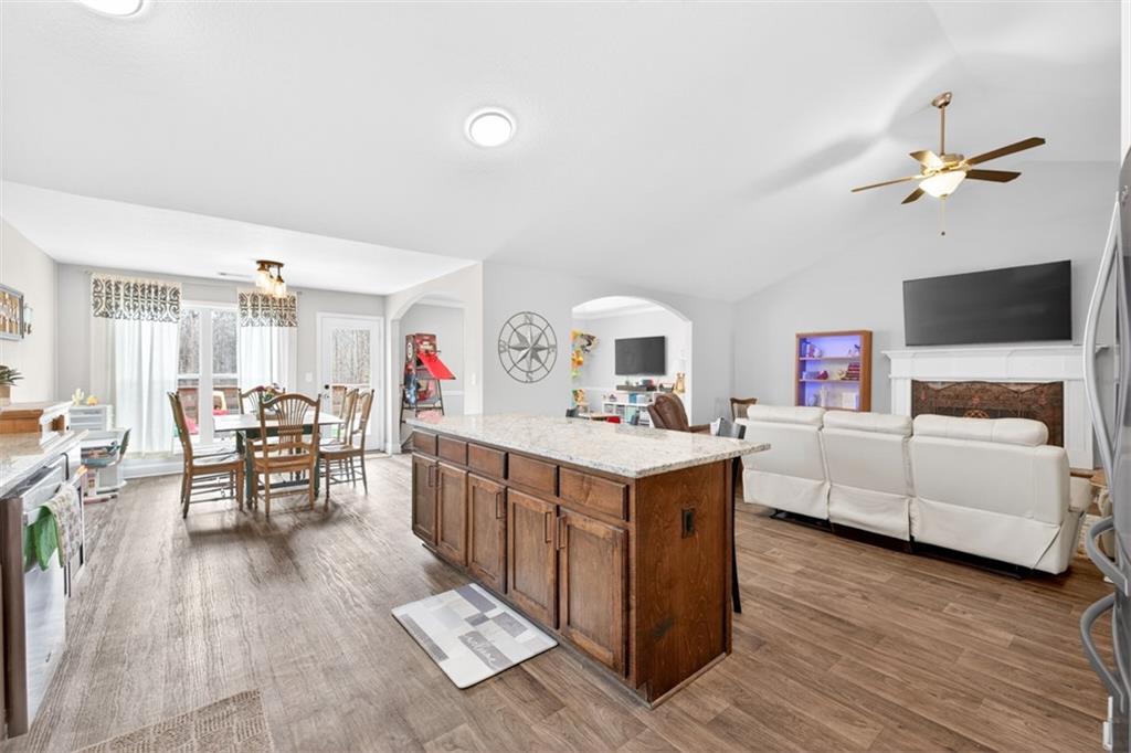 225 Tyler Way Jefferson, GA 30549 - Photo 20 of 43 a living room with furniture and a flat screen tv