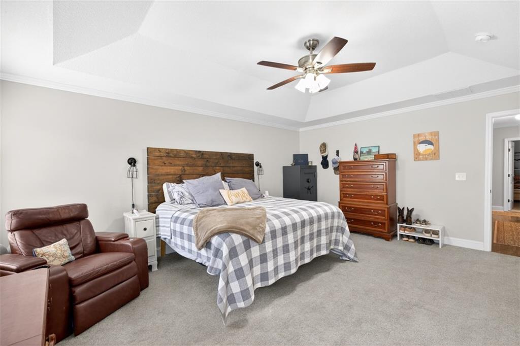 225 Tyler Way Jefferson, GA 30549 - Photo 31 of 43 a bedroom with a bed and ceiling fan