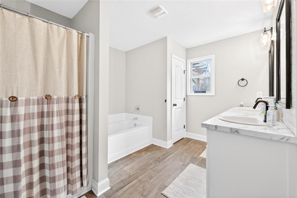 225 Tyler Way Jefferson, GA 30549 - Photo 33 of 43 a bathroom with a sink a toilet and shower