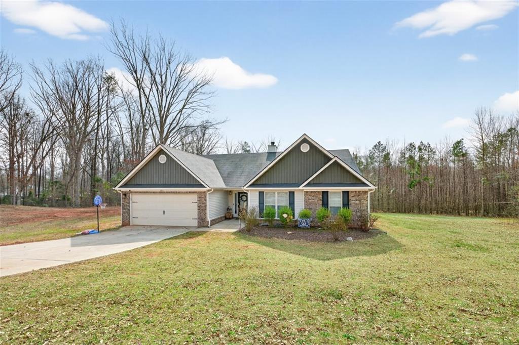 225 Tyler Way Jefferson, GA 30549 - Photo 4 of 43 a house with trees in the background
