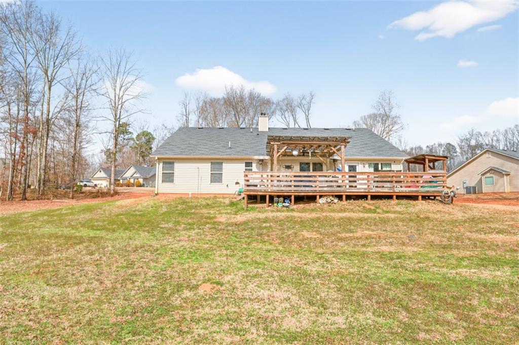 225 Tyler Way Jefferson, GA 30549 - Photo 41 of 43 a front view of a house with swimming pool and trees