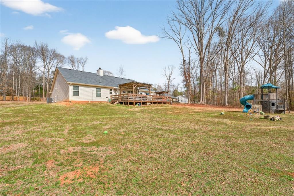 225 Tyler Way Jefferson, GA 30549 - Photo 43 of 43 a view of a house with a yard and trees
