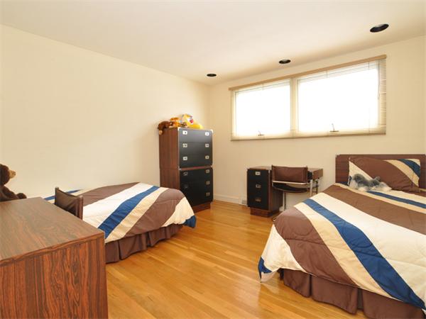 55 Gary Road Needham, MA 02494 - Photo 13 of 30 a bedroom with two beds and a window