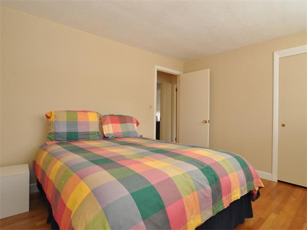 55 Gary Road Needham, MA 02494 - Photo 18 of 30 a bedroom with a bed and a couch