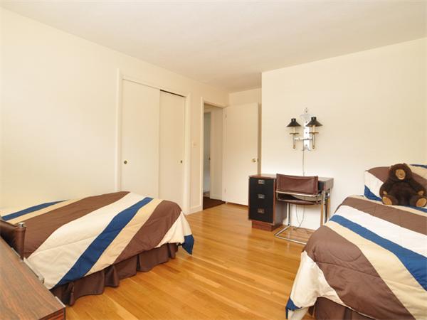 55 Gary Road Needham, MA 02494 - Photo 10 of 30 a bedroom with a bed and a table