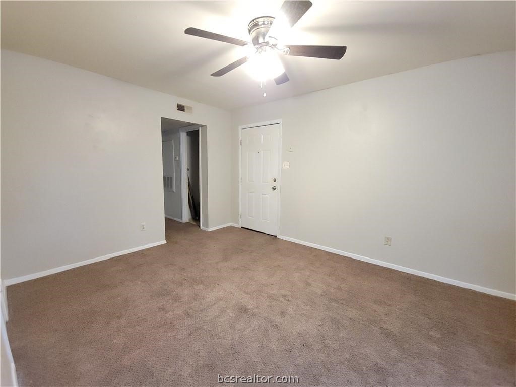 2712 Evergreen Circle Bryan, TX 77801 - Photo 11 of 30 Empty room with carpet flooring and ceiling fan