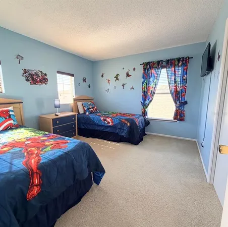 a bedroom with bed and window
