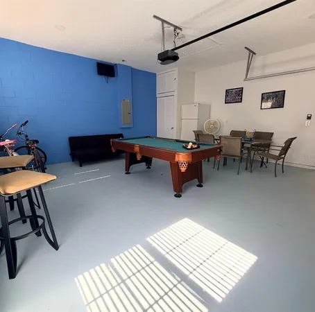 a living room with furniture a rug and a table