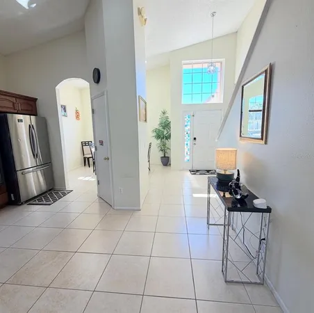 a view of a livingroom with furniture and a window