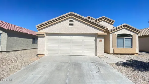 a view of the house with a garage
