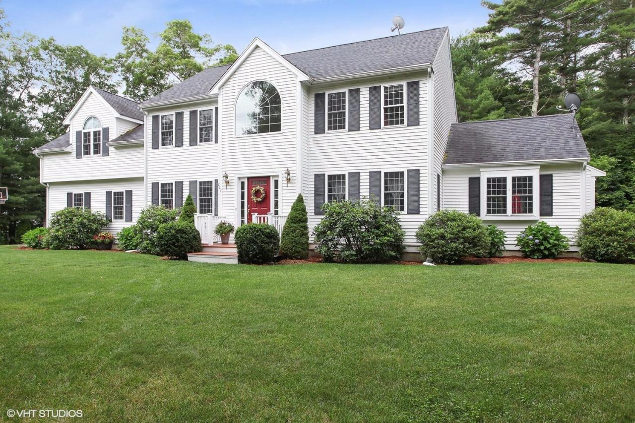 272 Cotuit Road Mashpee, MA 02649 - Photo 1 of 15 a front view of a house with a garden
